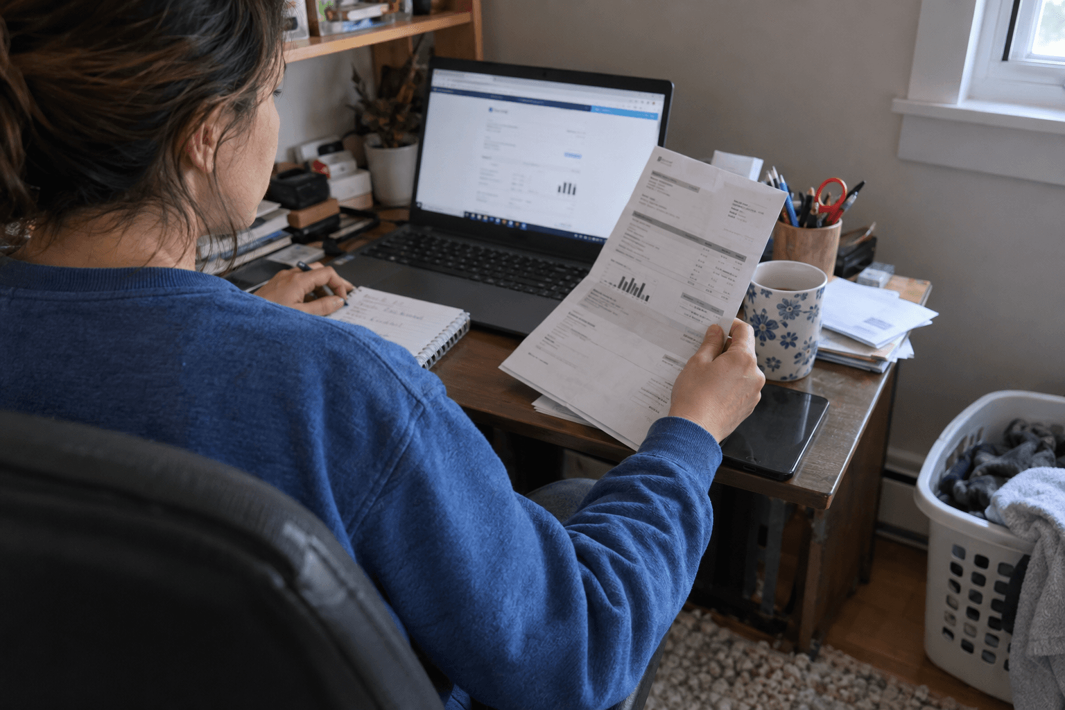 A shared household bill compared with work-use notes.